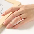 Detailed shot of a 2mm red beaded ring worn on a finger for a minimalist look - Southern Red Agate