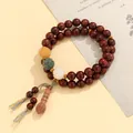 Double-strand green sandalwood Buddhist beads bracelet featuring carved lotus charms - Sandalwood Bodhi Style
