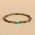 Elegant handmade green sandalwood bead bracelet featuring a turquoise accent bead - Verawood Turquoise Style / Green