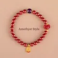 Red cinnabar bead bracelet featuring a single purple amethyst and gold charm. - Blessing Cinnabar Amethyst Style