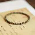 Handcrafted green sandalwood bead bracelet with natural wood grain on vintage paper - Verawood Plain Circle Style / Green