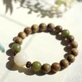 Handcrafted green sandalwood bead bracelet with jade accents and a carved white bead - Ruyi Single Wrap Style