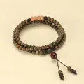 Handcrafted green sandalwood Buddhist prayer bead bracelet featuring a red accent focal bead - 108 Prayer Beads (6mm)