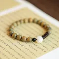 Handcrafted green sandalwood Buddhist bead bracelet with white lotus accent - Verawood Bracelet with Lotus Charm