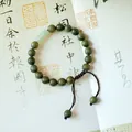 Handcrafted green sandalwood bead bracelet featuring a jade-like cylinder bead and cord - Braided Women's Verawood Bracelet (8mm)