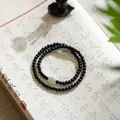 Green sandalwood Buddhist bead bracelet with pale green accent bead in double loop style - Ebony Multi-wrap Bracelet
