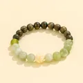 Elegant green sandalwood and jade style beaded bracelet featuring a carved cream flower - Ivory Nut Xiuyu Jade Bracelet (Men) / Dark Green