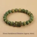 8mm natural green sandalwood beaded bracelet featuring a carved wood barrel charm - Verawood Carved Barrel Bead Bracelet (8mm)
