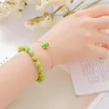 Elegant double-layered bracelet featuring green patterned stone beads and a slim gold chain. - Imperial Jasper (Beaded Bracelet + Chain)