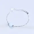 Elegant sterling silver box chain bracelet featuring a single light blue round bead - Platinum Plated - Aquamarine