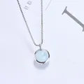 Elegant silver necklace with round light blue crystal pendant on white background - Aquamarine (Silver Chain)