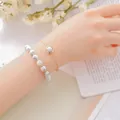 Elegant double-layered bracelet set featuring white marble stone beads and a delicate gold chain - White Turquoise (Beaded Bracelet + Chain)
