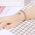 Elegant strawberry quartz beaded bracelet and silver chain shown on a hand model - Strawberry Quartz (Beaded Bracelet + Chain) Silver Color
