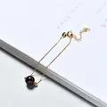 Minimalist gold chain bracelet featuring a single dark red strawberry quartz bead - Gold Plated - Garnet Red