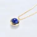 Elegant gold necklace featuring a polished round blue lapis lazuli style gemstone pendant - Lapis Lazuli (Gold Chain)