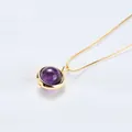 Elegant gold chain necklace featuring a round purple crystal pendant on white linen - Amethyst (Gold Chain)