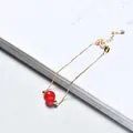 Elegant gold chain bracelet with a single round red strawberry crystal bead for women. - Gold Plated - Red Agate