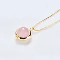 Elegant minimalist rose quartz pendant necklace with thin gold chain on white fabric - Rose Quartz (Gold Chain)
