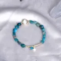 Elegant minimalist blue apatite beaded bracelet with cat-eye stone and gold star charm - Apatite