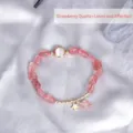 Elegant pink strawberry crystal beaded bracelet with cat-eye stone and gold star charm - Strawberry Quartz