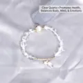 Elegant clear quartz bead bracelet with cat-eye stone and gold star charm detail - White Crystal