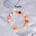 Handmade orange agate beaded bracelet with star charm and gold accents - Agate
