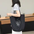 Black nylon tote bag with heart-shaped 'Have a nice day' print, casual SKU variant view - Black