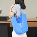 Casual blue nylon tote bag for women featuring white heart and Have a nice day print - Blue