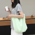 Stylish mint green nylon tote bag featuring white heart print and slogan for women - Yellow