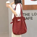 Stylish burgundy polka dot canvas tote bag with drawstring closure for casual women's use - Red