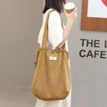 Trendy casual brown canvas tote bag with black polka dots and drawstring closure for women - Brown