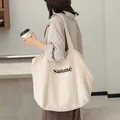 Minimalist Japanese style linen tote bag featuring Salomé letter print in off-white finish - Hemp Color