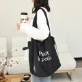 Casual black drawstring canvas tote bag with Petit à petit letter print for women - Black