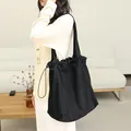 Large black drawstring tote bag in soft faux suede material for daily casual wear - Black