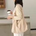 Minimalist beige suede large capacity shoulder bag featuring a unique knotted strap design - Apricot