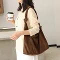 Grande borsa hobo marrone in finta pelle scamosciata con tracolla a nodo da donna chic - Caffè