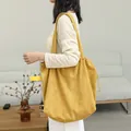 Stylish yellow corduroy drawstring tote bag for women featuring a large capacity design - Yellow