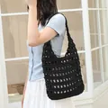 Elegant black hand-woven crochet shoulder bag featuring a stylish hollow-out design - Black