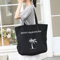 Japanese casual black nylon tote bag featuring ENJOY YOUR HOLIDAY letter print and palm tree - Black
