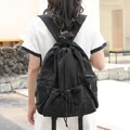 Casual Japanese style black nylon drawstring backpack with pleated design and high capacity - Black