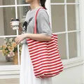 Casual red and white striped canvas tote bag with shoulder rope straps for women - Red