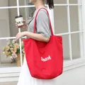 Stylish red nylon tote bag with white Beach print for women, casual summer style - Red