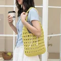 Stylish yellow hand-woven hollow cotton shoulder bag with drawstring inner pouch - Yellow