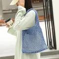 Light blue hand-woven cotton mesh shoulder bag for casual everyday wear. - Blue