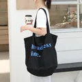 Large capacity black canvas bucket tote bag featuring blue letter print for stylish women - Black