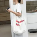 Bolso tote de lona blanca casual con estampado de letras rojas headless inc - Blanco Roto
