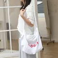 Japanese style white nylon crossbody bag with red GOODS lettering and knotted strap - White
