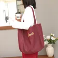 Bolso tote vintage de denim burdeos con bordado amarillo Super Dog para mujer estilo retro - Rojo
