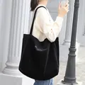 Stylish black corduroy tote bag featuring minimalist letter embroidery for casual wear - Black