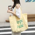 Stylish light yellow nylon tote bag with green letter print for fashionable casual daily wear - Yellow